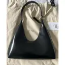 Buy By Far Amber patent leather handbag online