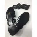 Saint Laurent Cassandra patent leather flip flops for sale