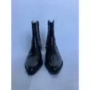 Fall Winter 2020 patent leather western boots Sandro
