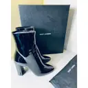Lou patent leather boots Saint Laurent