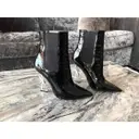 Buy Saint Laurent Opyum patent leather ankle boots online