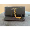 Pompom Kate patent leather clutch bag Saint Laurent