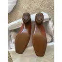 Leather mules & clogs Neous