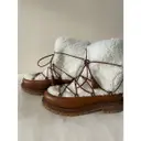 Buy Aquazzura Mongolian lamb boots online