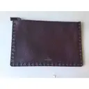 Valentino Garavani Rockstud leather clutch bag for sale