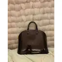Buy Louis Vuitton Alma patent leather handbag online