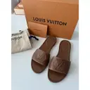 Buy Louis Vuitton Lock It leather mules online