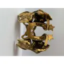 Buy Alexander McQueen Gold gold and steel Bracelet online