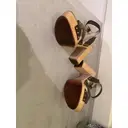 Python mules & clogs Prada