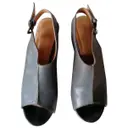 Leather mules & clogs Strenesse