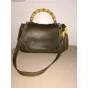 Buy Gucci Convertible Pompon Bamboo Top Handle leather handbag online