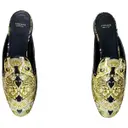 Leather mules & clogs Versace