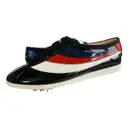 Patent leather low trainers Gucci