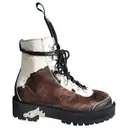 Pony-style calfskin lace up boots Off-White