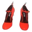 Flame patent leather heels Prada