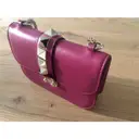 Buy Valentino Garavani Glam Lock leather clutch bag online