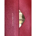 Buy Coccinelle Leather clutch bag online