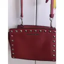 Buy Michael Kors Selma leather clutch bag online