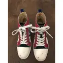 Buy Christian Louboutin Lou Spikes leather trainers online