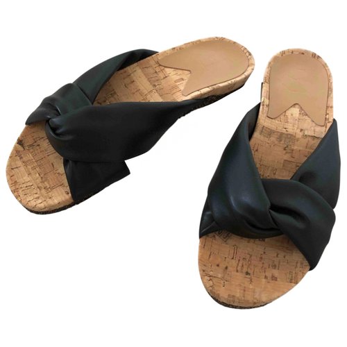 Pre-owned Flattered Mules In Black
