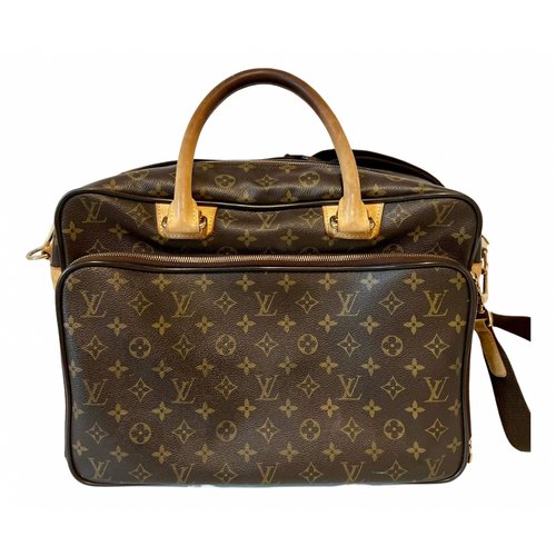 Pre-owned Louis Vuitton Icare Cloth Bag In Brown